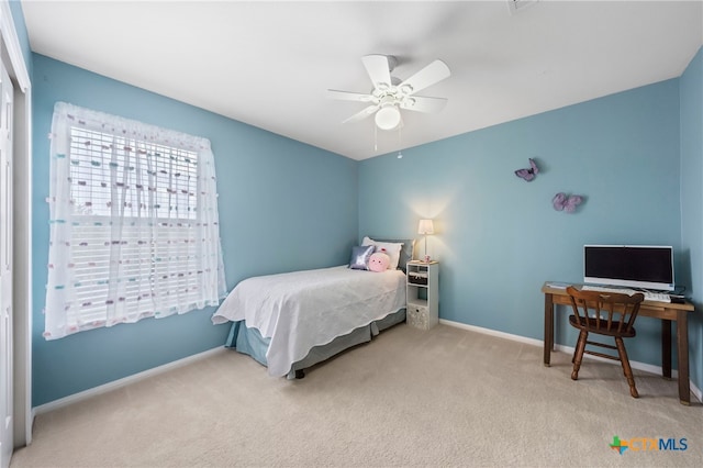 bedroom featuring light carpet and ceiling fan