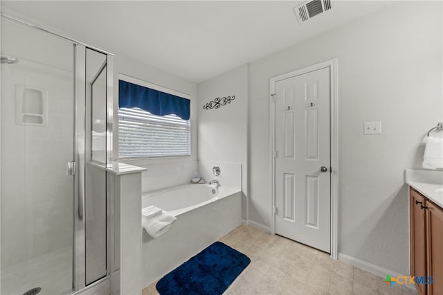 bathroom featuring vanity and plus walk in shower