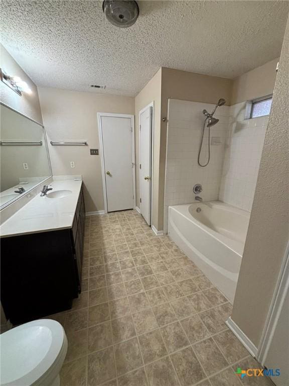 bathroom with visible vents, baseboards, vanity, bathtub / shower combination, and a textured ceiling