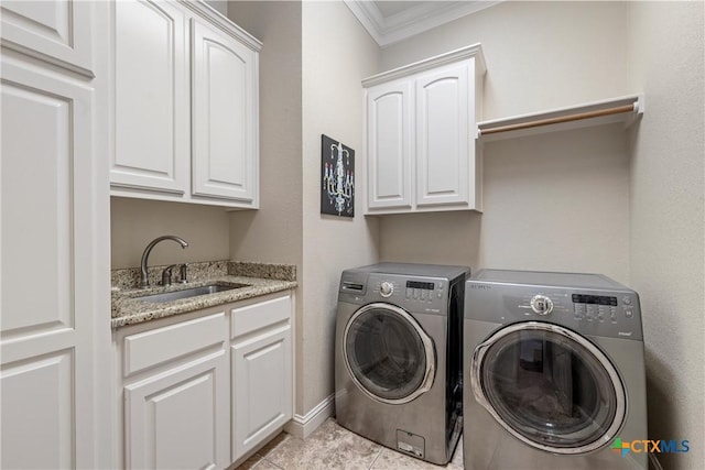 laundry area with washing machine and clothes dryer, tile patterned floors, a sink, cabinet space, and crown molding