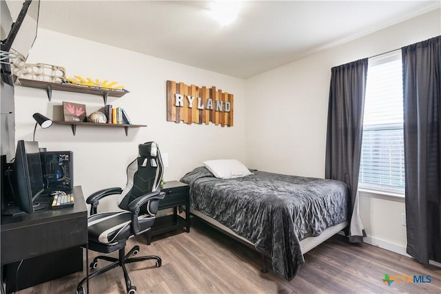 bedroom featuring dark wood-type flooring