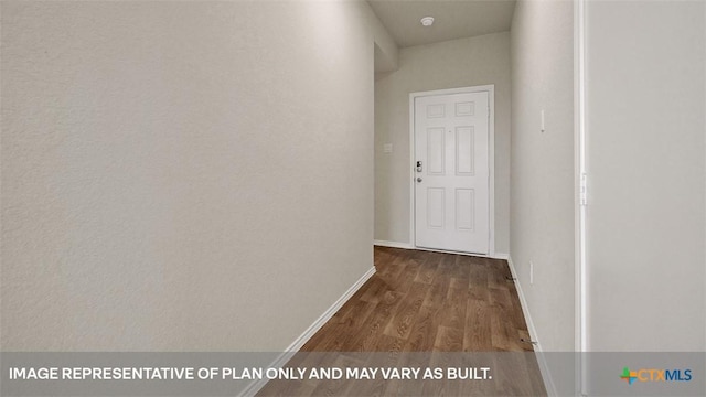 corridor with dark hardwood / wood-style flooring