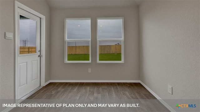 spare room featuring hardwood / wood-style flooring