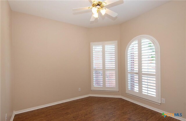 1935 Grandview Dr, Salado, TX 76571 - unfurnished room with dark wood-type flooring, healthy amount of natural light, and ceiling fan