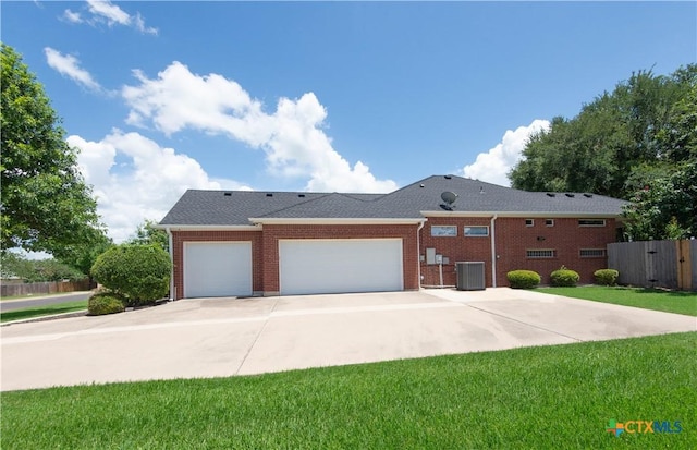 1935 Grandview Dr, Salado, TX 76571 - view of front facade with an attached garage, driveway, and brick siding