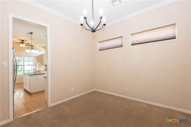 1935 Grandview Dr, Salado, TX 76571 - spare room with light carpet, a chandelier, crown molding, and ceiling fan