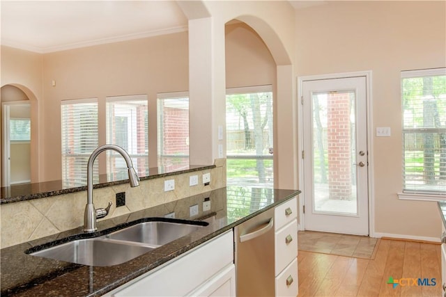1935 Grandview Dr, Salado, TX 76571 - kitchen featuring dishwasher, dark stone counters, backsplash, white cabinets, and ornamental molding