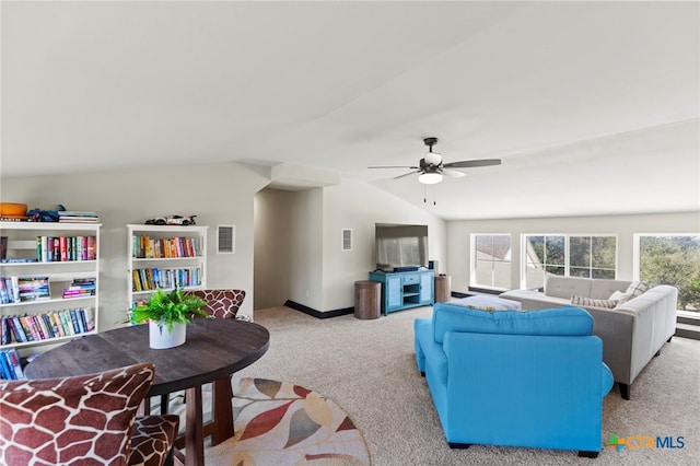 living room with light carpet, ceiling fan, and lofted ceiling