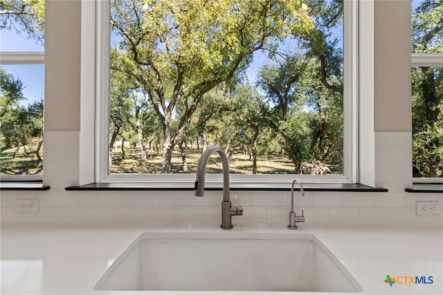 interior details with decorative backsplash and sink