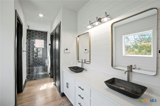 bathroom with vanity and hardwood / wood-style flooring