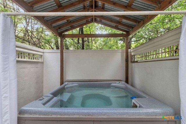 view of patio / terrace featuring a covered hot tub