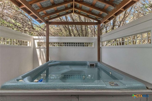 exterior space featuring a hot tub