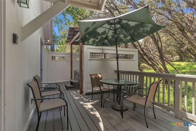 wooden terrace with outdoor dining area