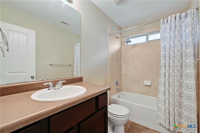 full bath with visible vents, toilet, tile patterned floors, shower / bathtub combination with curtain, and vanity