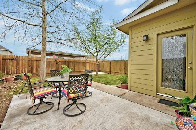 view of patio / terrace with a fenced backyard and outdoor dining area