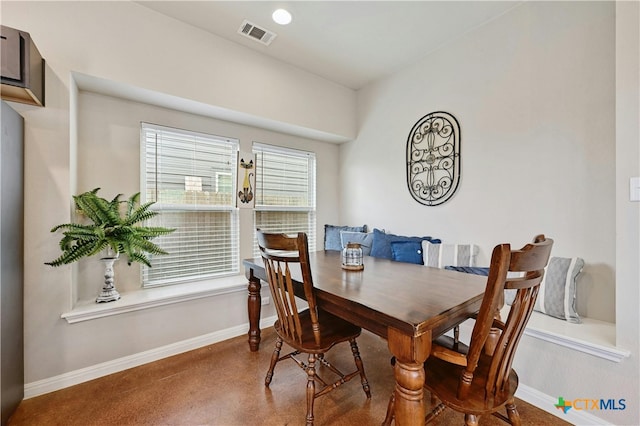 dining room featuring visible vents and baseboards