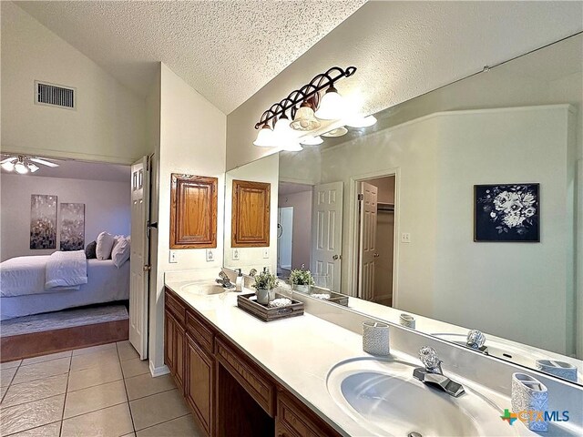 110 Ashford Dr, Victoria, TX 77904 - full bathroom featuring a sink, visible vents, lofted ceiling, and tile patterned floors