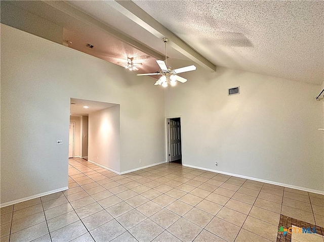 spare room featuring a textured ceiling, ceiling fan, beamed ceiling, and light tile patterned floors