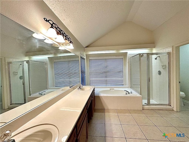 full bathroom with vanity, lofted ceiling, tile patterned flooring, toilet, and a textured ceiling