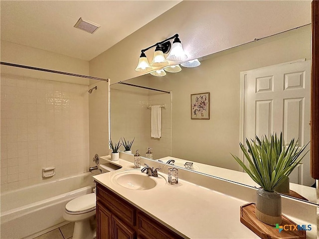 110 Ashford Dr, Victoria, TX 77904 - bathroom featuring tile patterned flooring, visible vents, washtub / shower combination, toilet, and vanity