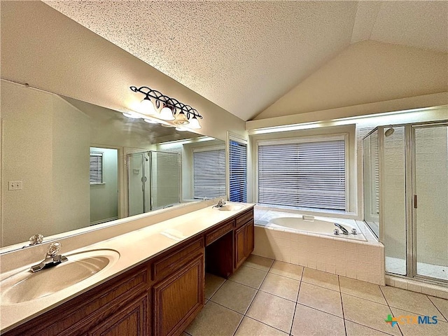 bathroom featuring vanity, plus walk in shower, tile patterned floors, vaulted ceiling, and a textured ceiling