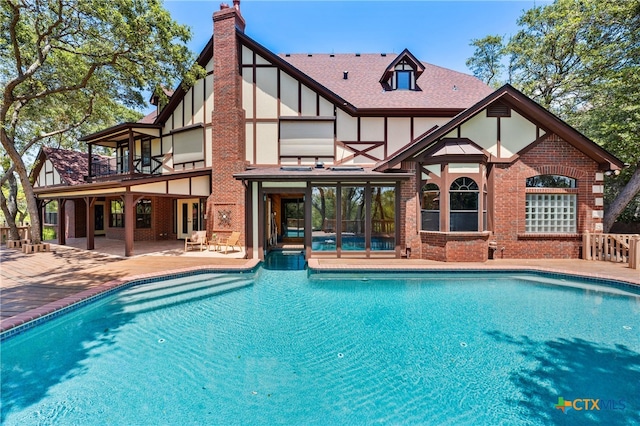 view of pool featuring a patio