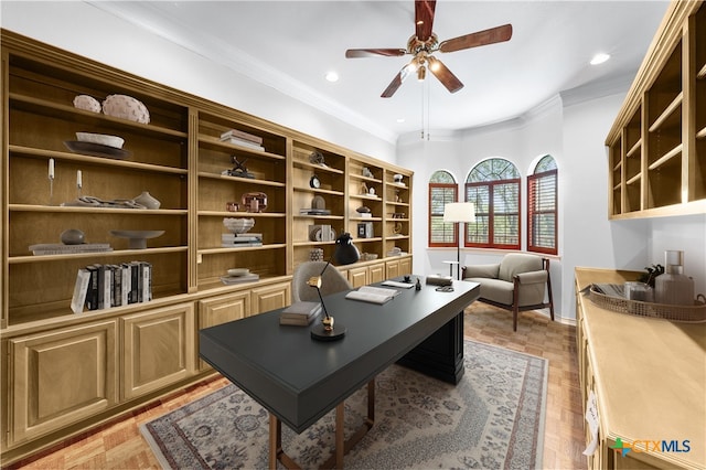 home office with ceiling fan, crown molding, and light parquet floors