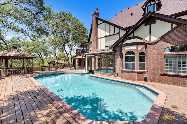 view of swimming pool with a gazebo