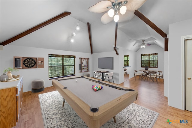 game room with a healthy amount of sunlight, light wood-type flooring, and lofted ceiling