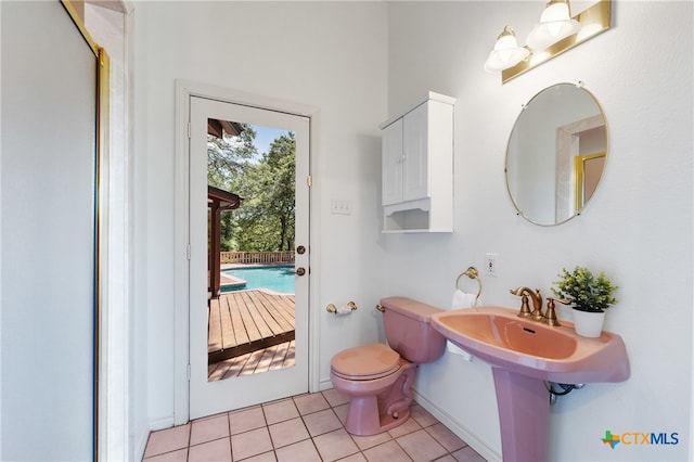 bathroom featuring tile patterned flooring and toilet