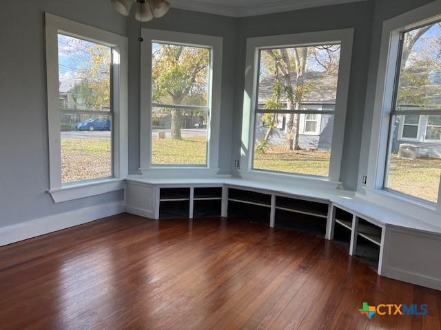 unfurnished sunroom with plenty of natural light