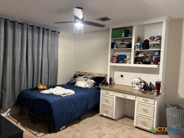 bedroom with ceiling fan and light colored carpet