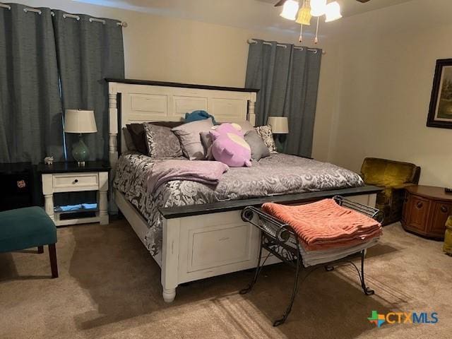 bedroom with ceiling fan and carpet flooring