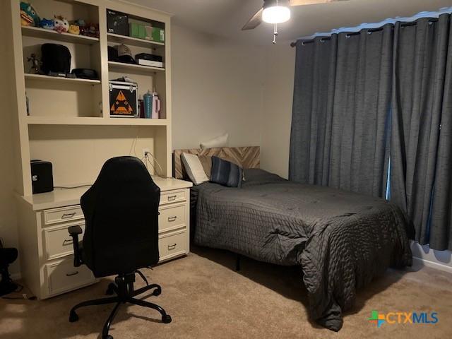 carpeted bedroom with ceiling fan