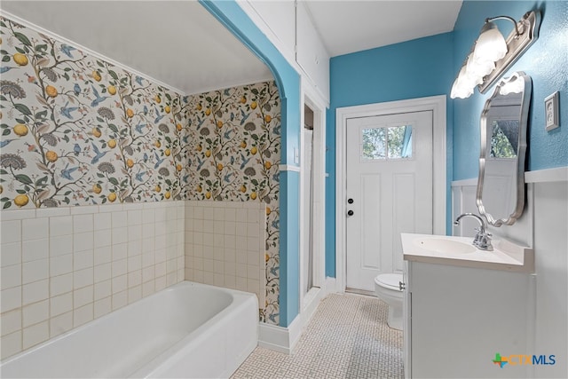 bathroom featuring vanity, tile patterned flooring, toilet, and a bathing tub