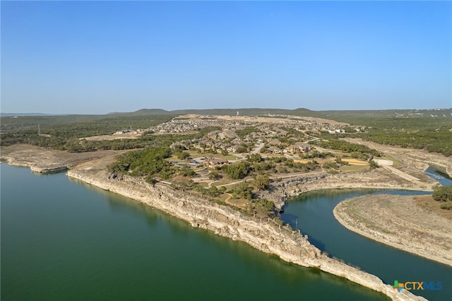 aerial view featuring a water and mountain view