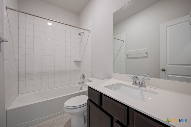 bathroom with tile patterned floors, vanity, toilet, and shower / bathing tub combination