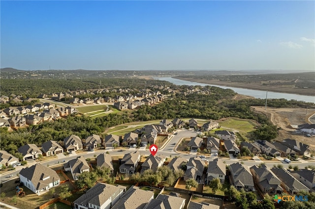 birds eye view of property with a residential view and a water view