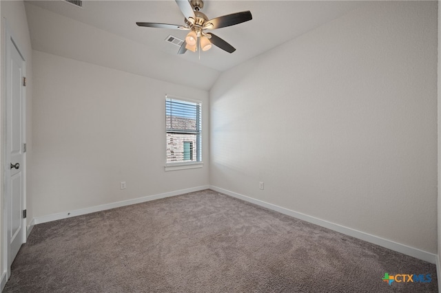 carpeted empty room featuring visible vents, baseboards, ceiling fan, and vaulted ceiling