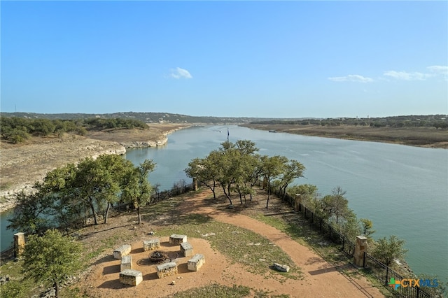 property view of water with an outdoor fire pit