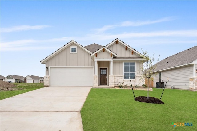 704 Seven Springs Dr, Temple, TX 76502 - craftsman inspired home featuring board and batten siding, a front lawn, stone siding, and concrete driveway