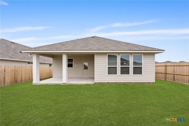 704 Seven Springs Dr, Temple, TX 76502 - rear view of property with a fenced backyard, a patio, a lawn, and roof with shingles