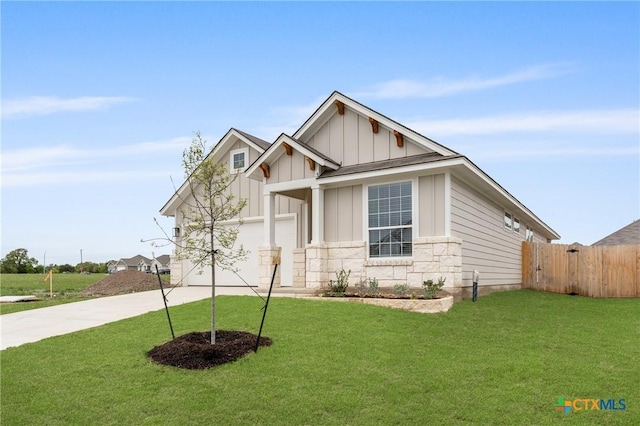 704 Seven Springs Dr, Temple, TX 76502 - craftsman house featuring board and batten siding, a front lawn, an attached garage, and driveway