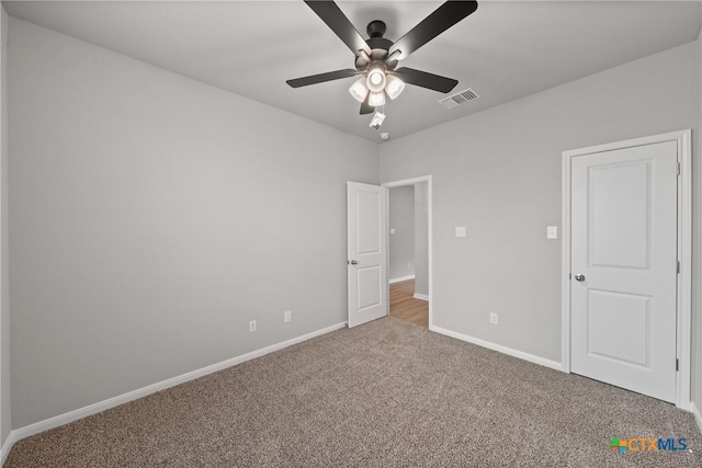 704 Seven Springs Dr, Temple, TX 76502 - unfurnished bedroom with ceiling fan, carpet flooring, baseboards, and visible vents