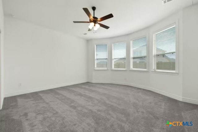 unfurnished room featuring ceiling fan and carpet floors