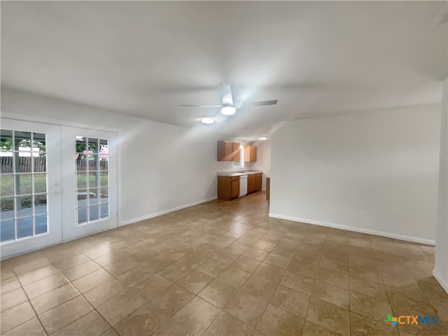 empty room with french doors and ceiling fan