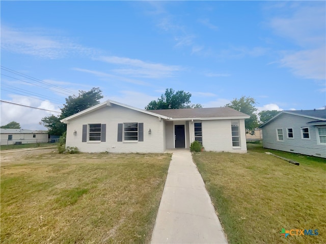 view of front of property with a front lawn