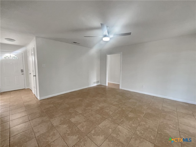 spare room with ceiling fan