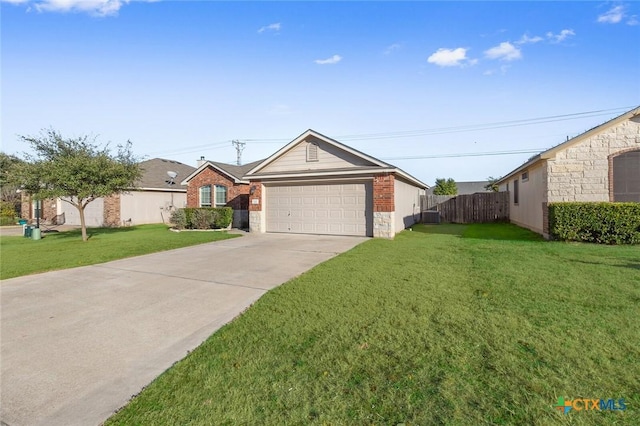 ranch-style house with a garage, fence, stone siding, concrete driveway, and a front yard