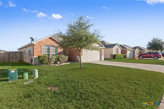 single story home with driveway, fence, a front lawn, and brick siding